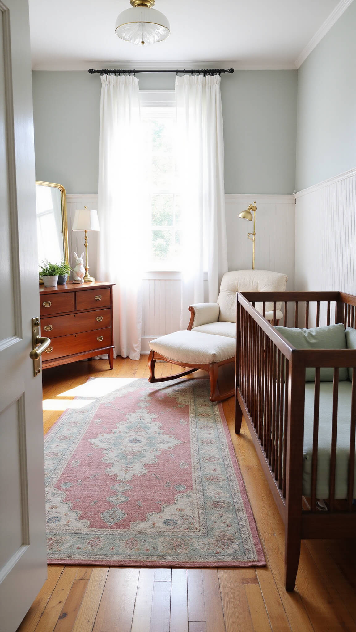 Serene nursery with warm walnut crib, cream boucle glider, mid-century teak dresser, and vintage details, bathed in soft morning light through tall curtained windows.